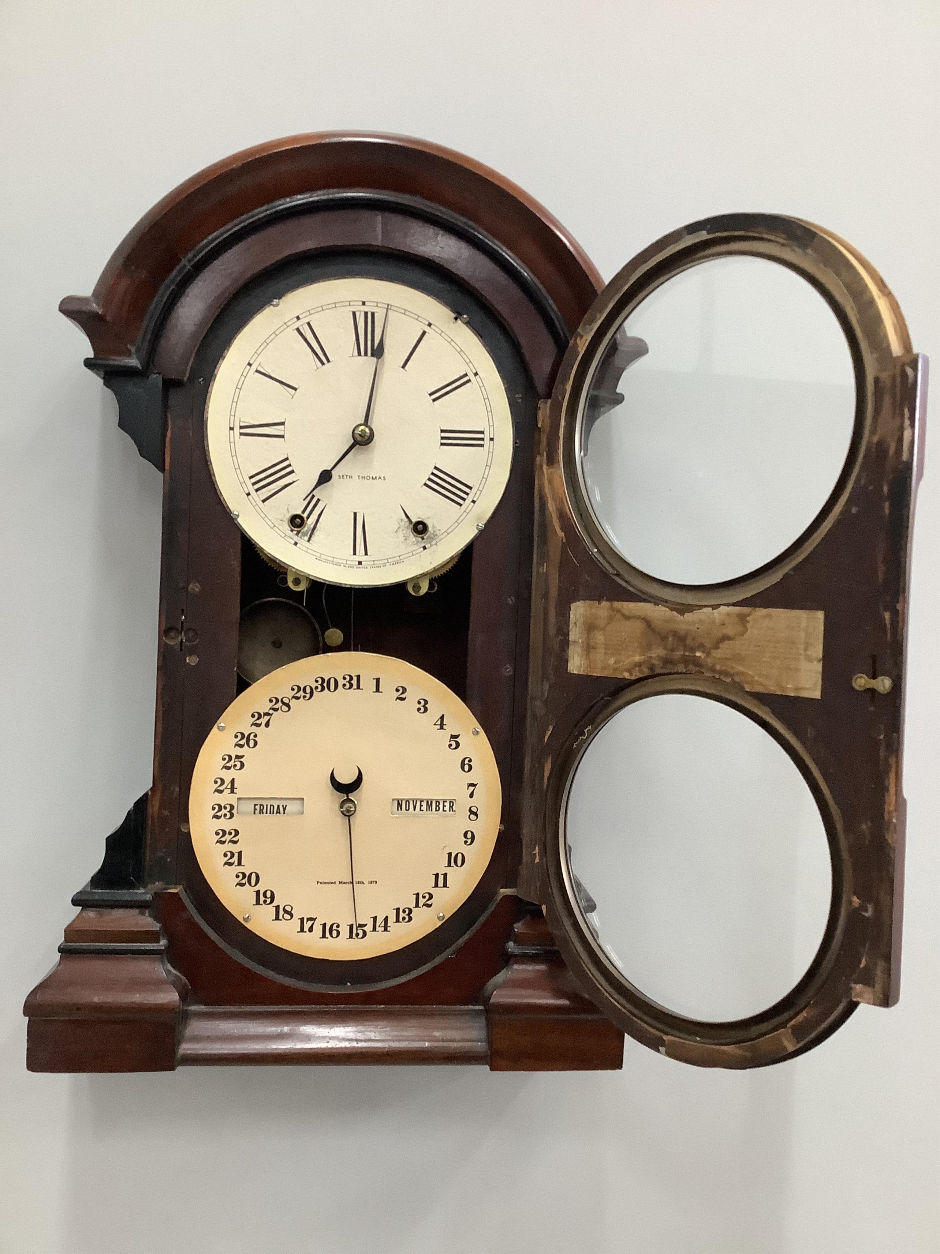 A late 19th century mahogany American wall timepiece / calendar by Seth Thomas, height 61cm. Condition - fair